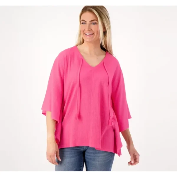 Shop All<Belle by Kim Gravel Packabelle Poncho with Tassels - a world of fashionable women's clothing, including a wide selection of dresses and trendy accessories.